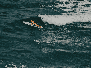 Tailslide-surf-as-meditation_surf-girl-padling-out
