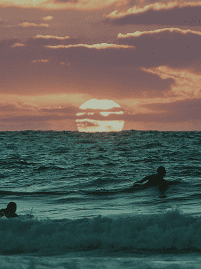 Tailslide local surf coaching_surfer paddling at sunset at Madiha surf break Sri Lanka_our mission_About