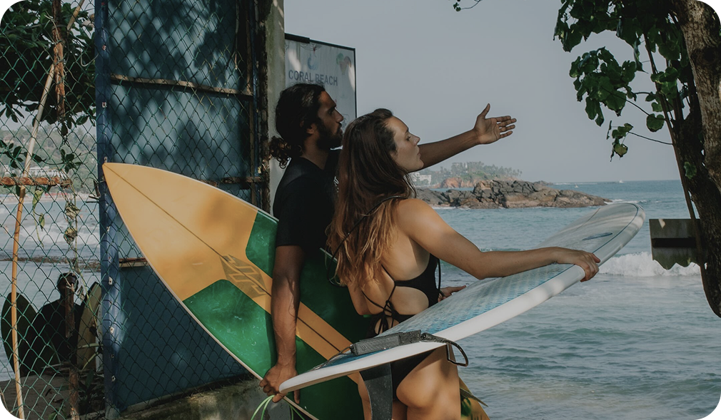 Tailslide_Surf coaching session in Madiha, Sri Lanka_local surf coach guiding a girl surf student guest on technique and board control during an intermediate surf lesson_surf coaching page